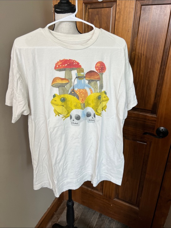 Hot Topic Other - Off white Graphic Tee with Yellow Frogs & Red Mushrooms